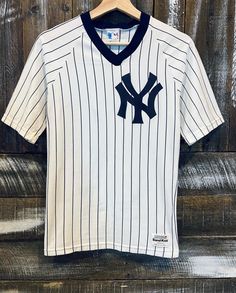 "Vintage NY Yankees Sand Knit Shirt. Like the one 2Pac wore in \"Nothing but Trouble\"! It's a size small and fits tight with a stretchy feel to it. Measures 16.5\"x26\", best for xs/s I would say but please refer to measurements for best fit. Check out v__asinvintage on IG for more!" Fitted Moisture-wicking Crew Neck Jersey, Fitted Jersey With Graphic Print And Crew Neck, White Crew Neck Jersey With Graphic Print, Fitted Crew Neck Jersey With Graphic Print, Fitted Graphic Print Crew Neck Jersey, Casual White Short Sleeve Jersey, White Short Sleeve Casual Jersey, Casual White Jersey With Graphic Print, White Casual Jersey With Graphic Print