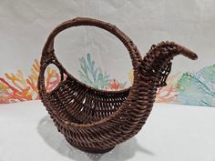 a brown wicker basket sitting on top of a table