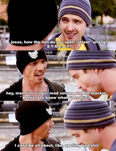 two young men talking to each other while wearing beanies and one has his mouth open