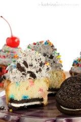 an oreo ice cream cake with cookies and sprinkles on a plate