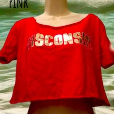 Beautiful For Your Teen Crop Wisconsin College Collection Pink Bright Red Cotton Tops For Summer, Red Letter Print Tops For College, Summer School Spirit Tops, Red Summer T-shirt For College, Red T-shirt For College Summer Events, Summer Cotton Tops With School Spirit, Red T-shirt For College Summer, Red Short Sleeve Top For College, Red Graphic Print Top For School Spirit