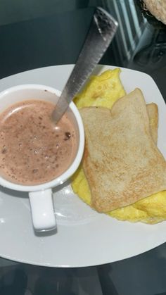 an omelet, toast and coffee on a plate