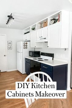 a kitchen with white cabinets and black appliances