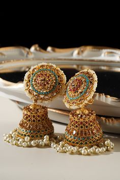 Embrace the elegance and artistry with the beautiful Samreen Jhumka Earrings. Crafted from high-quality brass and adorned with soft colors, these jhumka earrings are designed to make you stand out. Featuring multicolor navratan stones and gold plating with zircon stones, these 3-inch earrings are both chic and statement-making. These elegant jhumka earrings are not just a piece of jewelry but a statement art. With a push pin back and earring support backing, they ensure comfortable wear. Perfect Statement Art, Jhumka Earrings, Bleu Turquoise, Pin Backs, Push Pin, Soft Colors, Turquoise Blue, Gold Plating, Blue Gold