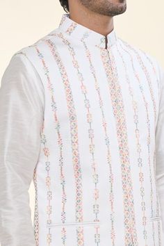 Off white solid kurta. Paired with a Nehru Jacket with thread embroidery and a matching plain mexican pant. - Aza Fashions White Sherwani With Chikankari Embroidery For Spring, Spring White Sherwani With Chikankari Embroidery, White Cotton Nehru Jacket For Festive Occasions, White Cotton Sherwani For Spring, Festive White Cotton Nehru Jacket, White Cotton Nehru Jacket, Festive White Outerwear With Chikankari Embroidery, White Nehru Jacket With Stand Collar For Festive Occasions, White Traditional Bandhgala For Spring