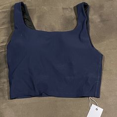 Tank Top With Built In Bra, Blue Nylon Top With Built-in Bra, Fitted Ribbed Casual Sports Bra, Casual Fitted Ribbed Sports Bra, Blue High Stretch Casual Crop Top, Casual High Stretch Blue Crop Top, Stretch Blue Tank Top With Seamless Construction, Blue Stretch Tank Top With Seamless Construction, Blue Stretch Seamless Tank Top