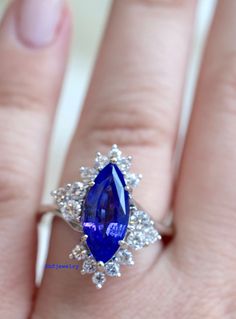 Metal: 14K White Gold Stone Types: Tanzanite And Diamonds Stone Shapes: Marquise tanzanite and round diamonds. Tanzanite Weight: Approx. 3 Carats Diamond Weight: Approx. .93 Carats Diamond Quality: Approx. SI1 G/H Weight: 6.30 Grams Size: 6 Sizable: Yes. Please state in note to seller box at checkout or message us. Original Price: $2,150.00 Appraisal & Gem Assessment: This service conducted by a GIA graduated gemologist can be provided to you free of charge. If you would like this service, p Blue Marquise Brilliant Cut Jewelry, Sapphire Multi-stone Diamond Gemstones, Brilliant Cut Tanzanite Gemstones For Gift, Brilliant Cut Tanzanite Gemstones As Gift, Elegant Blue Tanzanite Gemstones, Wedding Tanzanite Gemstones With Prong Setting, Exquisite Tanzanite Jewelry With Prong Setting, Timeless Tanzanite Jewelry With Accent Stones, Brilliant Cut Tanzanite Gemstones