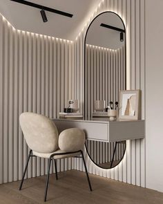 a white chair sitting in front of a mirror on top of a counter next to a vanity