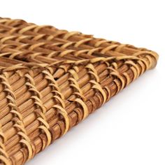 a close up view of a woven wicker place mat on a white background with clipping lines