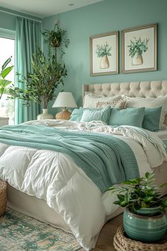 a bedroom with blue walls and white bedding, potted plants on the nightstands