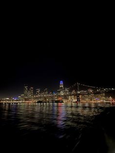 the bay bridge and san francisco skyline at night