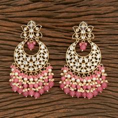 The Pink Mihika Earrings are stunning Earrings with Kundan and Gold Plating with Pink Beads. Specifications Materials used: Gold-Plating, Kundan, Pink Beads At Romikas, we pride ourselves on the craftsmanship and high quality of our jewelry, designed to enhance your natural beauty. Please contact us with any questions. Traditional Beaded Chandbalis For Festive Occasions, Fusion Style Chandelier Earrings With Dangling Beads, Festive Fusion Dangling Beads Earrings, Gift Chandbali Pearl Earrings With Dangling Beads, Traditional Dangling Beads Earrings For Celebration, Traditional Earrings With Dangling Beads For Celebration, Handmade Fusion Style Bridal Drop Earrings, Festive Dangling Beads Earrings For Celebration, Festive Celebration Earrings With Dangling Beads