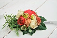 a bridal bouquet with red and white flowers