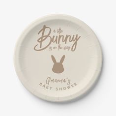 a paper plate with the words bunny is on the way and an image of a rabbit's head