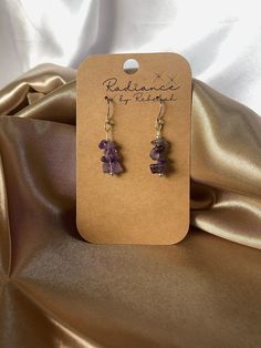 These amethyst earrings are great for the minimalist who still loves to *rock* some unique earrings!  Every item in my shop is handmade. All like pieces look similar, but none are identical. Each one is uniquely radiant <3 These crystals are authentic amethyst chips. Ear wires are made with silver or 14k gold plating. Corrosion is likely over an extended period of time. Irritation is possible for sensitive ears. The earring stoppers are made of silicone.  **These crystal chips are each naturally, abnormally shaped. So, every earring will look different and may vary slightly in length. Stacked crystals are about an inch in length while any that are wire wrapped are between 1.5-2 inches.**  I hope you feel like your most ~radiant~ self when wearing this piece! Nickel-free Amethyst Lavender Earrings, Nickel-free Lavender Amethyst Earrings, Nickel-free Lavender Earrings Gift, Spiritual Amethyst Drop Earrings, Gift Lavender Nickel-free Earrings, Adjustable Purple Earrings With Natural Stones, Purple Amethyst Spiritual Earrings, Spiritual Amethyst Purple Earrings, Spiritual Purple Amethyst Earrings