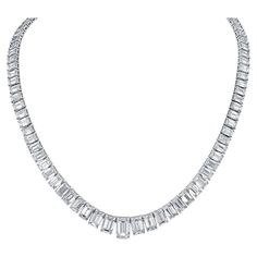 Elevate your elegance with our exquisite 19-inch Graduated Tennis Necklace, meticulously crafted in platinum and adorned with captivating emerald-cut diamonds. Each diamond is expertly set in a secure four-prong setting, showcasing their brilliance and clarity. The focal point of this masterpiece is the GIA certified H/SI2 emerald center, weighing 1.51 carats, radiating with unparalleled beauty and sophistication. With a total diamond weight of 30.04 carats, this necklace is a true statement of Luxury Prong Setting Necklace, Tennis Chain Jewelry, Luxury Formal Baguette Cut Tennis Necklace, Emerald Cut Necklace, Riviera Necklace, Diamond Tennis Necklace, Sparkly Things, Emerald Cut Diamond, Chicago Pd