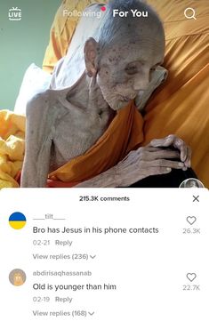 an old man sitting on top of a bed next to a yellow sheet covered pillow