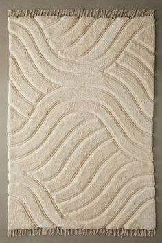 a white rug with waves on it