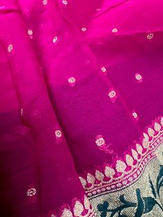 SILK MARK CERTIFIED !!! Stunning Hot Pink Color Pure Khaddi Banarasi Georgette Silk Saree with Meenakari Floral Weaving Floral Pattern on the Borders and Pallu with Muted Gold Zari. Small Zari Weaved buttis all over the body of the Saree. Beautiful combination of Hot Pink and Bottle Green Color. Item : SareeBase Fabric : Pure Khaddi Georgette Silk Color : Hot Pink and Bottle Green Blouse piece : Comes with un-stitched Blouse piece.Blouse material : Pure Khaddi Georgette Silk Fall & Edging(Yes/No Celebration Banarasi Silk Blouse Piece, Banarasi Silk Blouse Piece For Celebration, Blouse Piece For Traditional Ceremonies At Eid, Pink Traditional Wear For Transitional Celebration, Pink Traditional Wear For Celebration, Festive Celebration Saree, Banarasi Silk Blouse Piece With Traditional Patterns, Semi-stitched Traditional Patterns Blouse Piece, Traditional Blouse Piece For Transitional Celebration