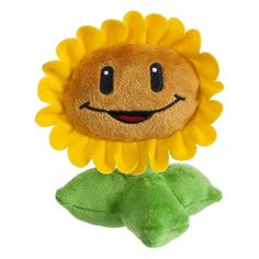 a stuffed sunflower with a smiley face on it's head and green leaves