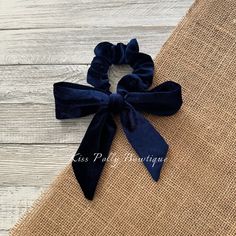 The midnight blue velvet bow hair tie features a deep, rich color and includes a detachable band for effortless bow styling.  This elegant accessory adds a touch of sophistication to any hairstyle, making it ideal for both casual and formal occasions.  The luxurious velvet texture not only looks chic but also ensures a secure hold, enhancing your overall look. Luxury Elegant Bow Tie For Formal Occasions, Luxury Detachable Bow Tie, Navy And Gold Hair Bow, Velvet Hair Bow, Bow Hair Tie, Christmas Hair Accessories, Tie Hair, Velvet Texture, Scrunchie Hair