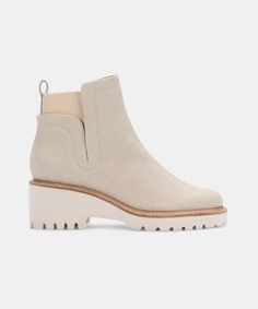 HUEY BOOTIES IN SANDSTONE CANVAS – Dolce Vita Beige Chelsea Boots, Neutral Heels, Trending Sandals, Lug Sole, Printed Leather, Synthetic Leather, Sock Shoes, Bootie, Chelsea Boots