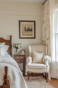 a bedroom with a bed, chair and window