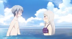 two people standing in the water looking at each other with clouds behind them and blue sky