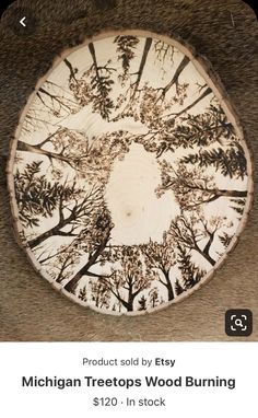 a wooden plate with trees on it