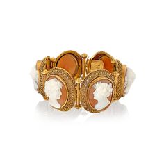 19th Century Cameo bracelet. Consisting of six individual oval sections, graduating in size, the largest being in the centre. DETAILS Each section contains a Shell Cameo with a 3D female head surrounded by Etruscan style applied bead and twisted wire work. The sections are joined by a bar, hinged in the centre. French import marks. 18ct yellow gold. Weight of bracelet 56.2 grams Luxury Cabochon Bracelets For Wedding, Luxury Wedding Bracelet With Cabochon, Heirloom Oval Bracelets For Formal Occasions, Oval Cabochon Bracelet For Wedding, Oval Cabochon Wedding Bracelet, Victorian Hallmarked Bracelets, Antique Gold Bracelet For Formal Occasions, Heirloom Style Gold Bracelet, Heirloom Style Hallmarked Gold Bracelet