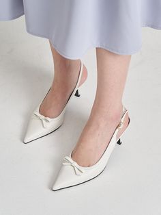 Hailey is a handmade shoe brand that prioritizes a comfortable fit that can be worn anytime, anywhere.- Feminine mood point toe slingback- Adjustable buckle strap on the ankle- Lovely ribbon decoration as a point- Comfortable to wear Chic White Slingback Pumps With Buckle Closure, Feminine High Heel Slingback Pumps With Bow Straps, Spring Ankle Strap Slingback Pumps, Chic White Slingback Pumps With Bow, Chic Spring Kitten Heels With Bow Straps, Chic Slingback Pumps With Round Toe And Buckle, Chic Slingback Pumps With Buckle Closure And Round Toe, Slingback Pumps With Strap For Spring, Chic Closed Toe Slingback Pumps With Bow