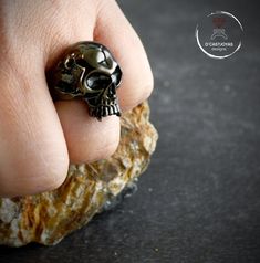 Vampire skull ring handmade in solid Sterling silver in our workshop in Madrid, Spain It is an open Ring so that it can adapt better to the finger you prefer, that is, it accepts several finger sizes (two or three sizes). Although you need to tell us the size of your finger to prepare it with the size of finger. Remember that in large sizes the price is higher. It is important that you first write us with that information so we can tell you the price * If you need to know the size of your finger Black Sterling Silver Skull Ring, Handmade Punk Skull Rings, Unique Black Skull Ring For Halloween, Hand Cast Black Skull Ring, Black Hand Cast Skull Ring Gift, Black Sterling Silver Skull Ring Hand Cast, Unique Hand Cast Black Skull Ring, Handmade Skull Ring For Halloween, Handmade Gothic Skull Ring