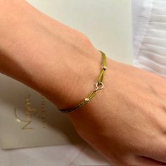 Experience enduring sophistication with our String Bracelet for Women—a delicate masterpiece embellished with 14k gold clips and solid 18k gold beads. This minimalist wish bracelet embodies understated luxury, perfect for solo wear, providing a delicate touch, or stacked to make a bold statement of friendship and style. Made from Solid 18k Gold Bead and 14k Gold Clips Waterproof jewelry Adjustable size 9 color options Gift packaging Quality certificate FREE shipping worldwide Bead size 3mm This Elegant White Gold Friendship Bracelets, Elegant Tiny Beads Jewelry For Everyday, Elegant Everyday Jewelry With Tiny Beads, Adjustable White Gold Beaded Bracelets, Adjustable White Gold Beaded Bracelet, Elegant Bracelets With Tiny Beads For Friendship, Adjustable Minimalist White Gold Beaded Bracelets, Minimalist Adjustable White Gold Beaded Bracelets, Dainty White Gold Adjustable Beaded Bracelets