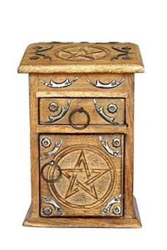 an ornate wooden box with a pentagram and star on the front, sitting on a white background