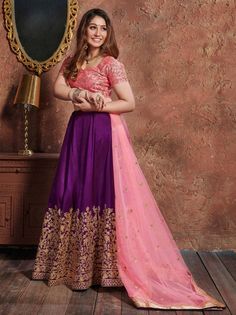 This floral & Zari Embroidered Lehenga Choli is bright and flowy, perfect for those haldi or tropical wedding events. The set consists of short sleeve blouse with sequins, zari & embroidery detailing, square neck. The flared lehenga has similar embroidery detailing and a dupatta to match. Color- Purple & Pink Fabric-Silk Dupatta Fabric - Net Blouse Sleeves-Short Sleeves Neck-Square Neck Lehenga length: Floor Length Washing instructions: Dry Clean Work-Floral & zari embroidery & round neckline Fl Pink Choli, Flared Lehenga, Zari Embroidery, Net Blouses, Indian Lehenga, Wedding Lehenga, Silk Wedding, Net Dupatta, Purple Silk