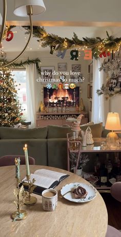 a living room filled with furniture and a fire place next to a christmas decorated tree