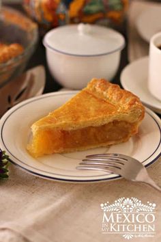 a piece of pie sitting on top of a white plate