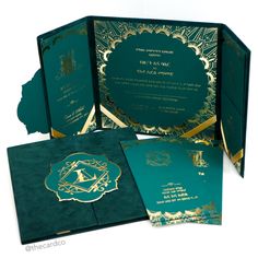 the inside of a green and gold wedding card with an intricate design on it's side