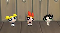 the powerpuff girls are standing next to each other in front of a door