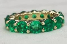 Gorgeous Eternity ring wedding or anniversary 14k yellow gold  ringSET 14 natural round green emerald weight 6.72ct carat total weight.  size 5mm natural  green emerald clean ,superb cut,very brilliant ,gorgeous green  color .Ring Size: 6.5Retail value $12,500 net .Appraisal availab Classic Green Gemstone Eternity Band, Formal Green Gemstone Eternity Band, Classic Green Round Cut Eternity Band, Classic Green Eternity Band For Anniversary, Green Prong-set Eternity Band For Anniversary, Green Eternity Band With Prong Setting For Anniversary, Classic Green Eternity Band For Formal Occasions, Green Round Eternity Band Fine Jewelry, Green Emerald Eternity Band For Anniversary