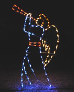 a lighted figure holding a heart and a baseball bat in it's hand with lights on