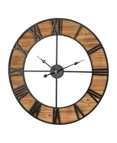 a large wooden clock with roman numerals on it's face and hands