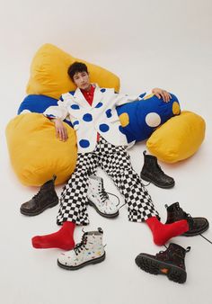 a man laying on top of a giant stuffed animal