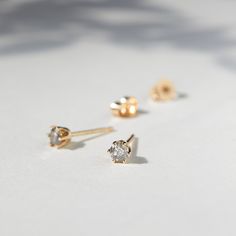 A sparkling brilliant cut gray diamond is set in a delicate crown setting. Maximally beautiful!Pale peach moonstones, luminescent gray diamonds, velvety black diamonds, and sparks of gold. Were proud to welcome the work of A.M. Thorne to Catbird. Elegant Everyday Jewelry With Rose Cut Diamonds, Dainty Diamond Earrings For Everyday, Elegant Diamond Earrings With Single Cut As Gift, Elegant Single Cut Diamond Earrings As Gift, Elegant Diamond Earrings With Single Cut Diamonds As Gift, Dainty Everyday Diamond Earrings With Single Cut, Dainty Everyday Diamond Earrings With Single Cut Diamonds, Gift White Topaz Diamond Accent Earrings, Delicate Everyday Diamond Earrings