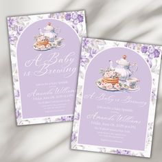 a baby is brewing tea party with purple and white flowers on the front and back