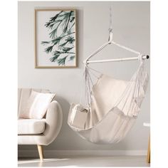 a white hanging chair in a living room