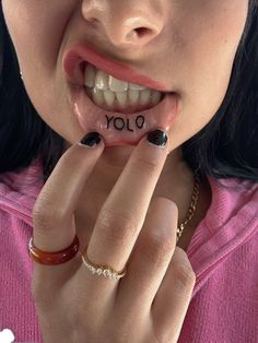 a woman is holding her finger up to her mouth with the word joy written on it