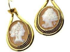 Cameo Earrings circa 1870 These wonderful antique earrings feature cameo carvings of non identical ladies facing in different directions. The earring wires are gold but the rest of the earrings are not. DATE/MARK: There is no hallmark however, we have tested the the earrings and the shepherd's hooks are 9 carat yellow gold. The mount is not gold. DIMENSIONS: The length of the earrings is 44 mm approx. The width of the earrings is 18.55 mm approx. WEIGHT: The combined weight of the earrings is 5. Antique Engraved Drop Earrings, Antique Cameo Yellow Gold Jewelry, Vintage Gold Cameo Earrings, Antique Historical Drop Earrings, Victorian Cameo Yellow Gold Earrings, Gold Hooks, Heart Padlocks, Cameo Earrings, Earring Wires