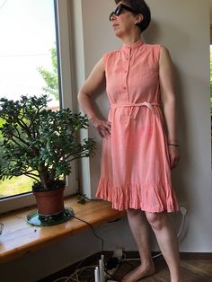 Vintage 90s summer dress. Sleeveless peach pink sun dress with stand up collar. Waist up buttoned dress with side pockets. Gauze cotton dress. M size. From shoulder to shoulder  14,5" 37cm Bust  37"  94cm Waist  40"  102cm Length  40" 102cm. 100% cotton. Pink Cotton Sleeveless Summer Dress, Sleeveless Peach Cotton Dress, Peach Sleeveless Cotton Dress, Casual Peach Sleeveless Sundress, Vintage Sleeveless Sundress For Daywear, Pink Sleeveless Summer Dress For Daywear, Pink Sundress Sleeveless For Daywear, Pink Sleeveless Sundress For Daywear, Pink Sundress