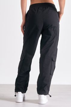 Channel utility-chic in Krystian pants. These cargo-style trousers feature large pockets and a parachute silhouette, with adjustable ankle drawstrings for versatile styling. Parachute Silhouette, Denim Dress Fall, Jumpsuit Coverup, Fall Bottoms, Jumpsuit Fall, Pants With Elastic Waist, Style Trousers, Black Cargo Pants, Jumpsuit Summer